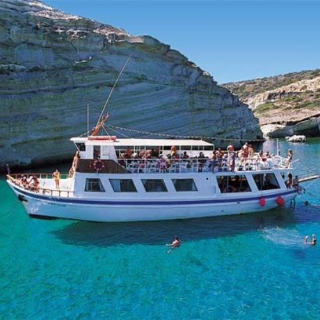 Milos, a boat touring the island to carry tourists to the isolated beaches, KLEFTIKO (Cave) MILOS