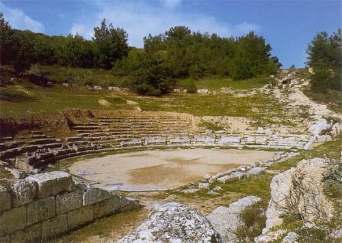 Sikyon, ancient theater. It lies below the acropolis of Sicyon; the first rows of seats, the orchestra with a subterranean passage and part of the skene are preserved  SIKYON (Ancient city) CORINTHIA