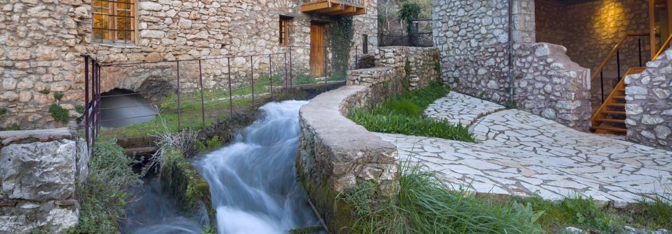 The water exits via the watermill’s flume and flows into the central water channel