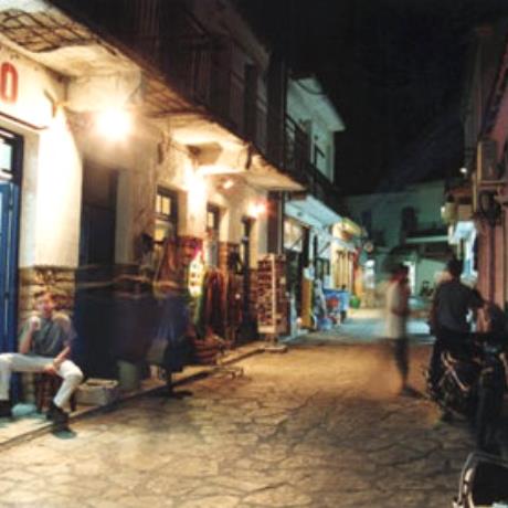 Paleros, a commercial street at night, PALEROS (Small town) AKTIO - VONITSA