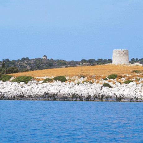 Kastos, a view of the island with a windmill being visible on the slope, KASTOS (Island) IONIAN ISLANDS
