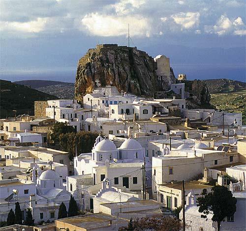 A view of Amorgos Chora (capital), which is built on a mountainous height at the center of the island; cycladean houses beneath the Venetian castle on the peak of the hill AMORGOS (Village) AMORGOS