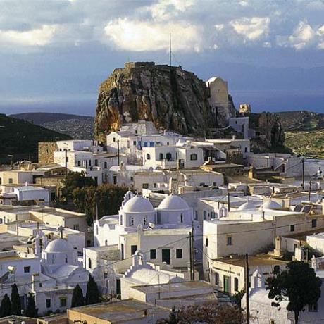A view of Amorgos Chora (capital), which is built on a mountainous height at the center of the island; cycladean houses beneath the Venetian castle on the peak of the hill, AMORGOS (Village) AMORGOS