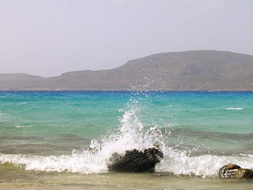 A wave breaking at the rock at Simos beach ELAFONISSOS (Island) PELOPONNISOS