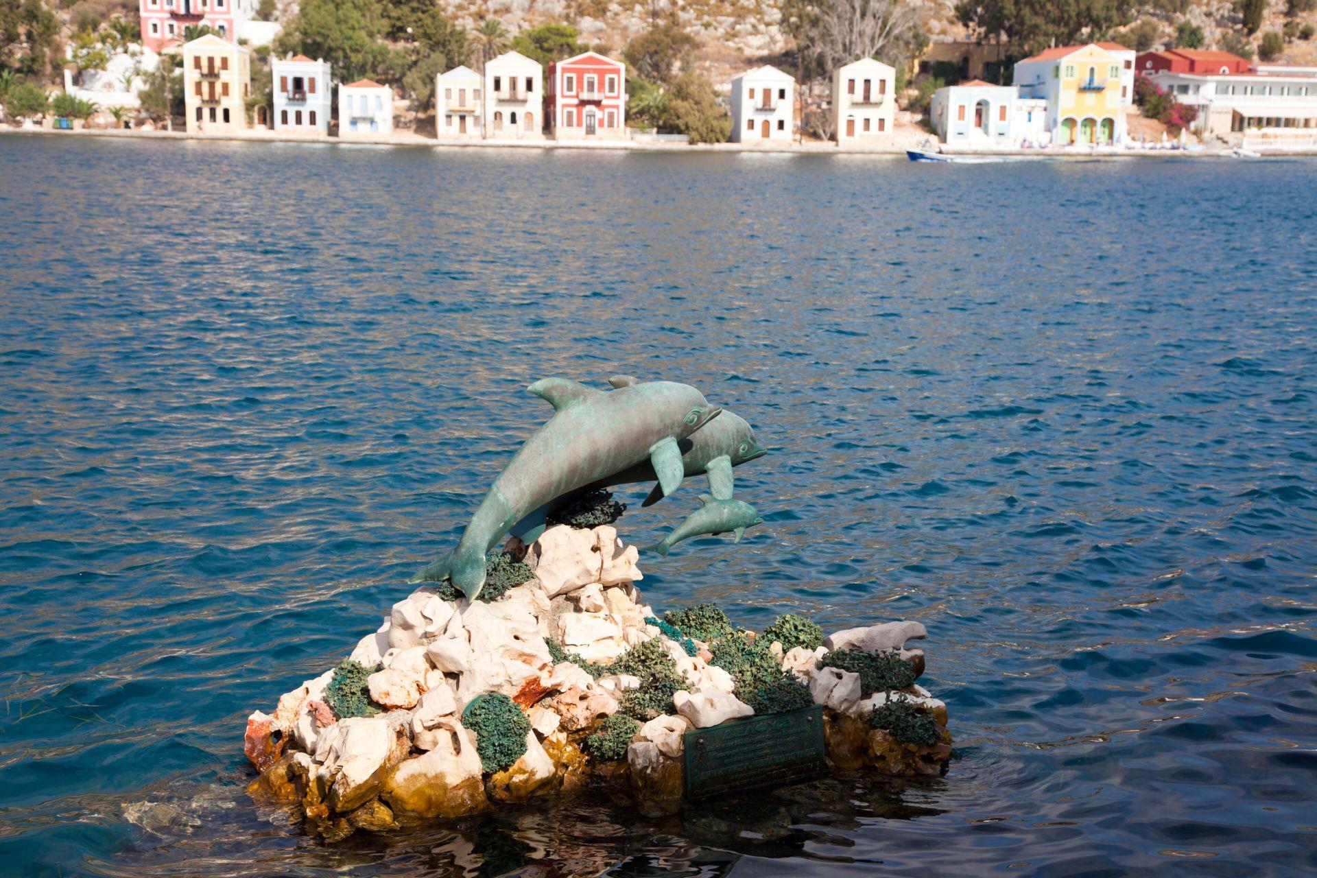 Dolphins statue at the Kastellorizo port MEGISTI (Village) DODEKANISSOS