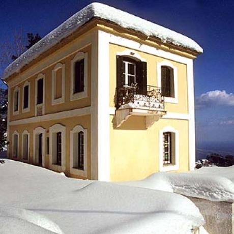 Traditional building covered with snow, AGIOS DIMITRIOS PELIO (Village) ZAGORA-MOURESI