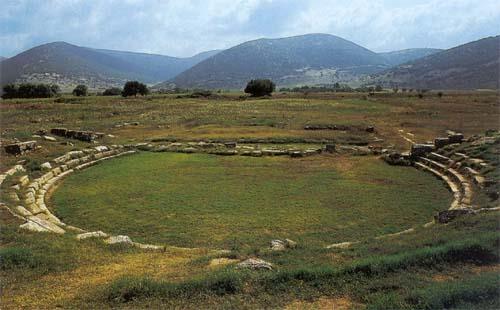 Mantineia ancient theater - The little theater of Mantineia delimits the west side of the agora; its cavea was formed on a man-made fill  MANTINIA (Ancient city) ARCADIA