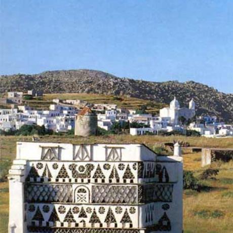 Panormos, a dovecote in the forefront , PANORMOS (Village) TINOS
