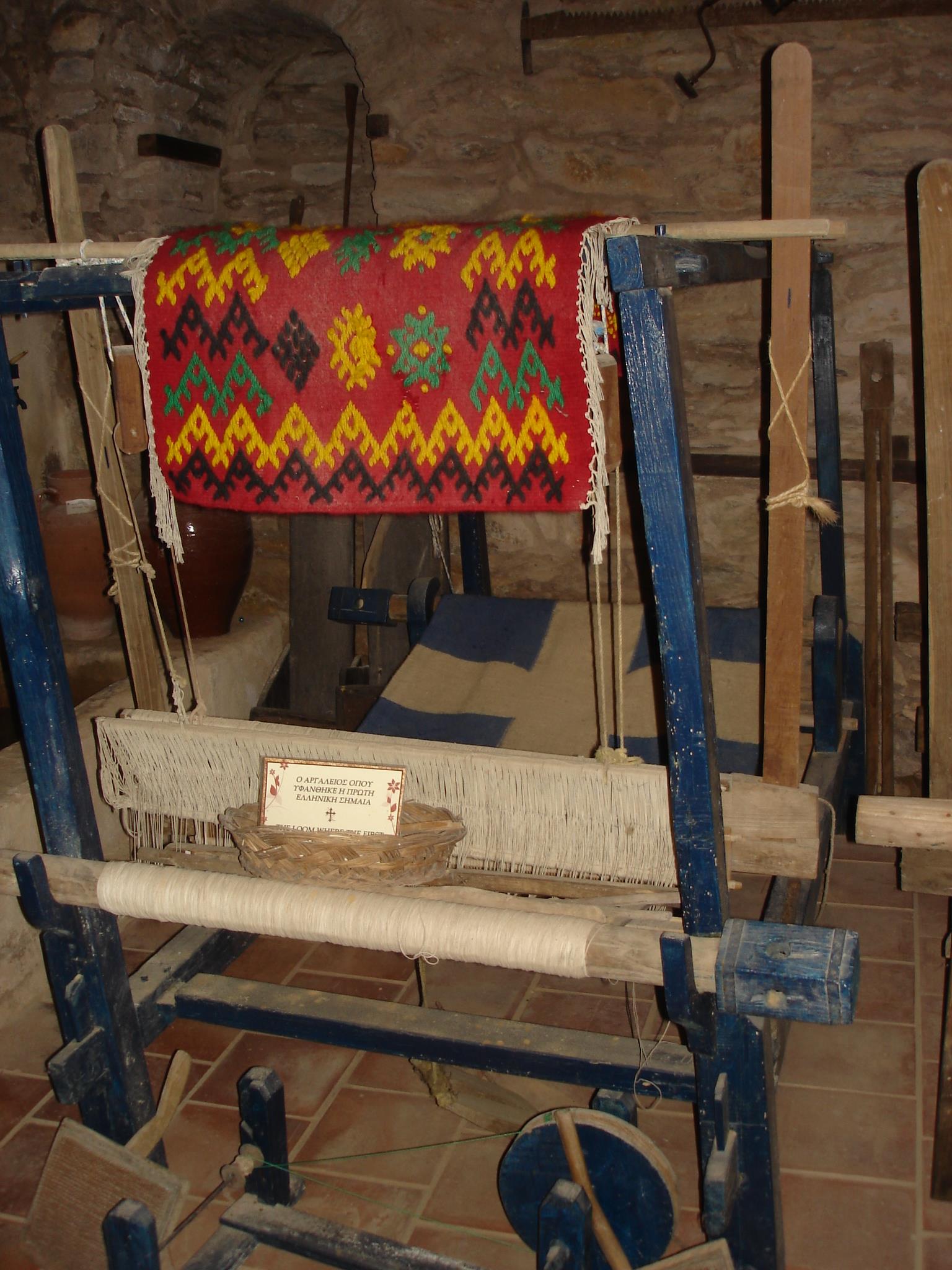 The loom, on which the fist Greek flag, symbol of the Greek Revolution for Independence, was wooven. It was a flag that has a white cross on a sky blue background. MONI EVANGELISTRIAS (Monastery) SKIATHOS