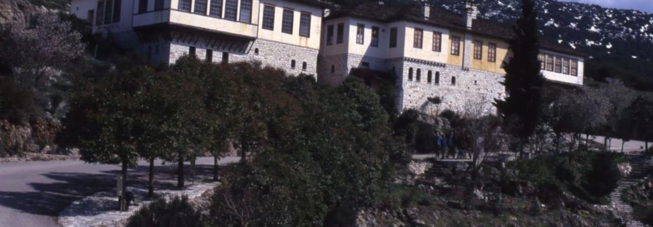 The traditional museum building set against the mountainous background