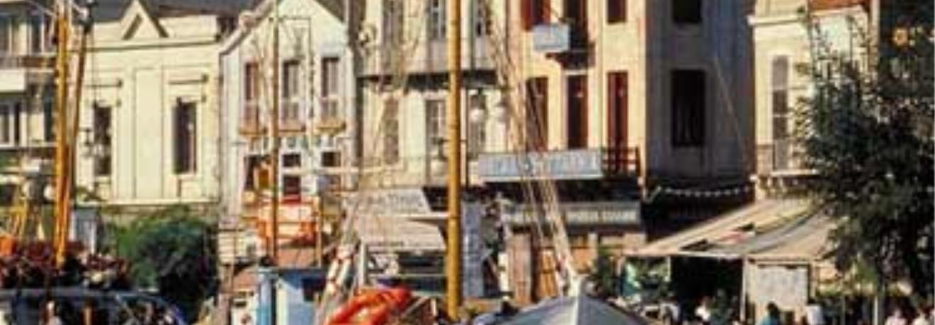 The church of Saint Therapon next to typical mansions on the quayside
