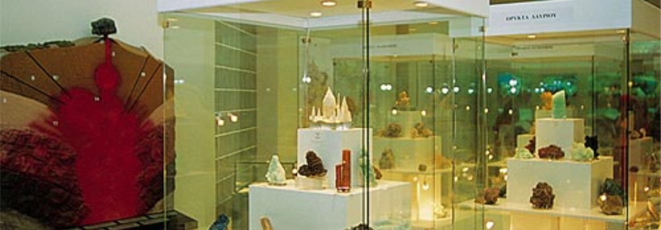 Mining Museum of Milos; display cabinets with rocks & minerals from Milos & other parts of Greece & displays of fossils, obsidian, bauxite, alumina & aluminium