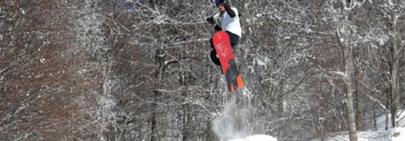 A leap with a snowboard
