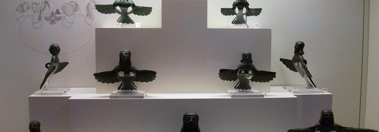 The female (sirens) and male winged figures, which like the griffins were daemonic beings of Eastern origin, served as joints on cauldron handles. 8th-7th centuries BC.